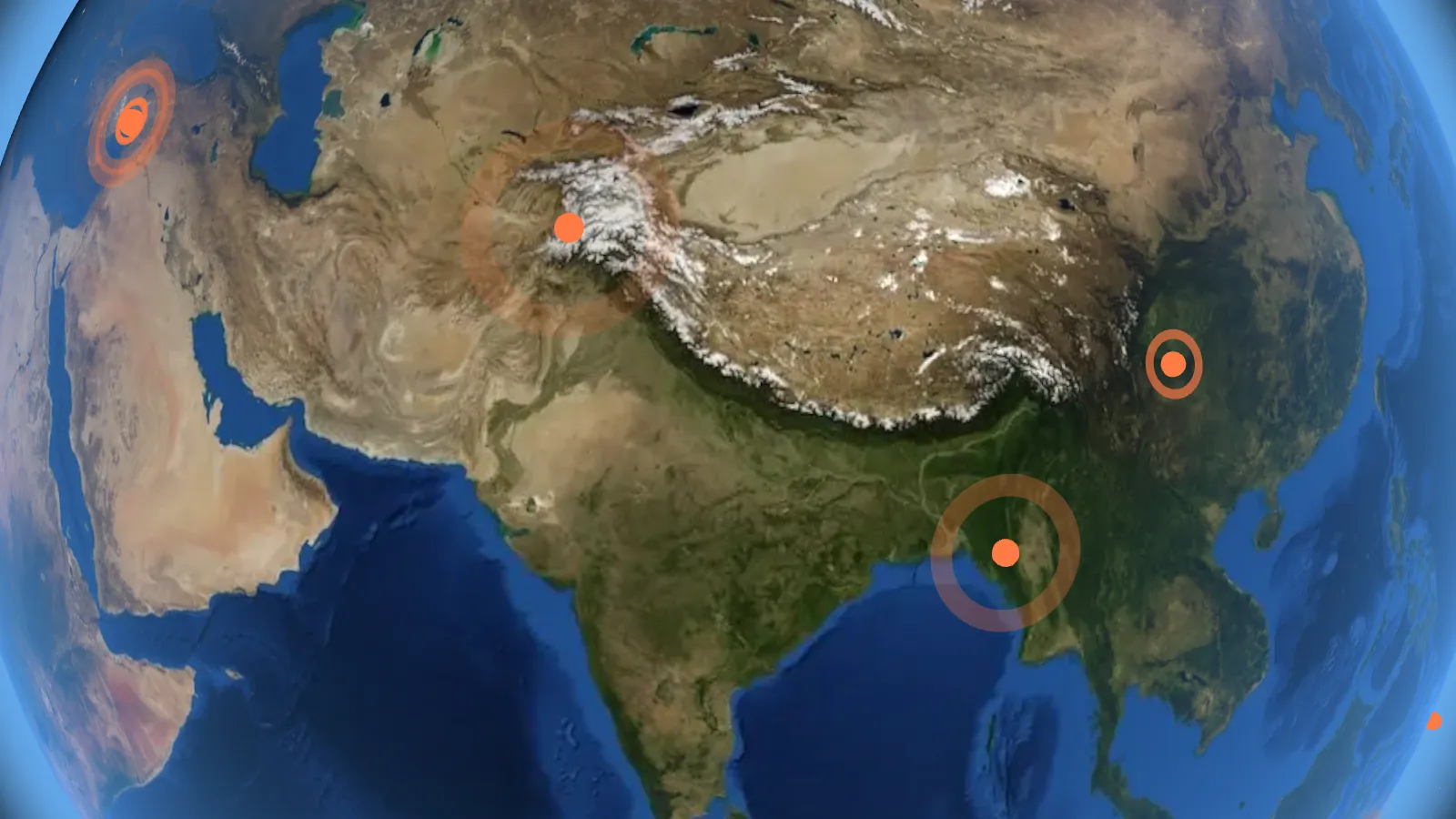 The Himalayas and the Indian subcontinent on a 3D globe, with live earthquakes marked